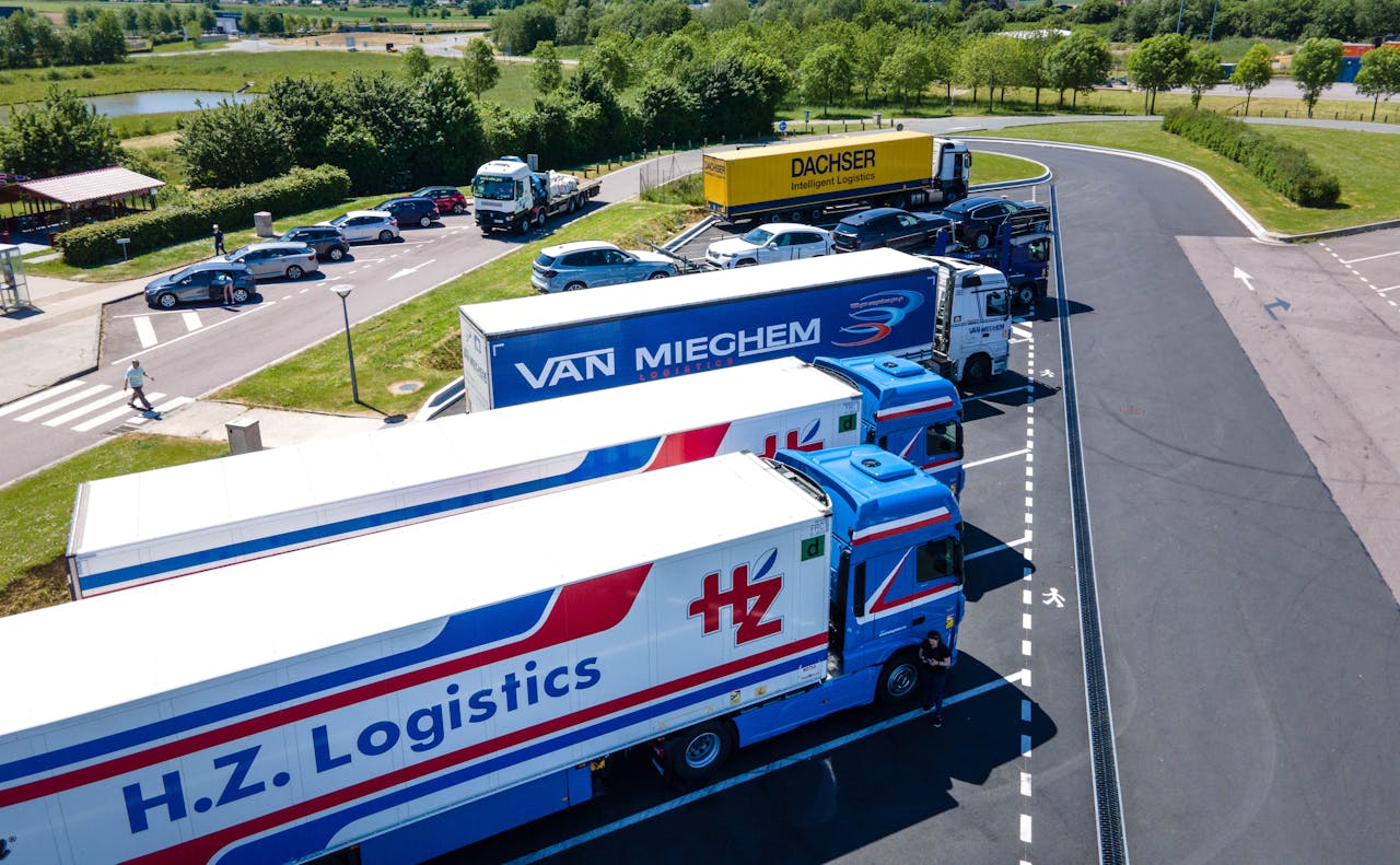 gallery-6 Aerial image showcasing logistics trucks parked in a rest area.